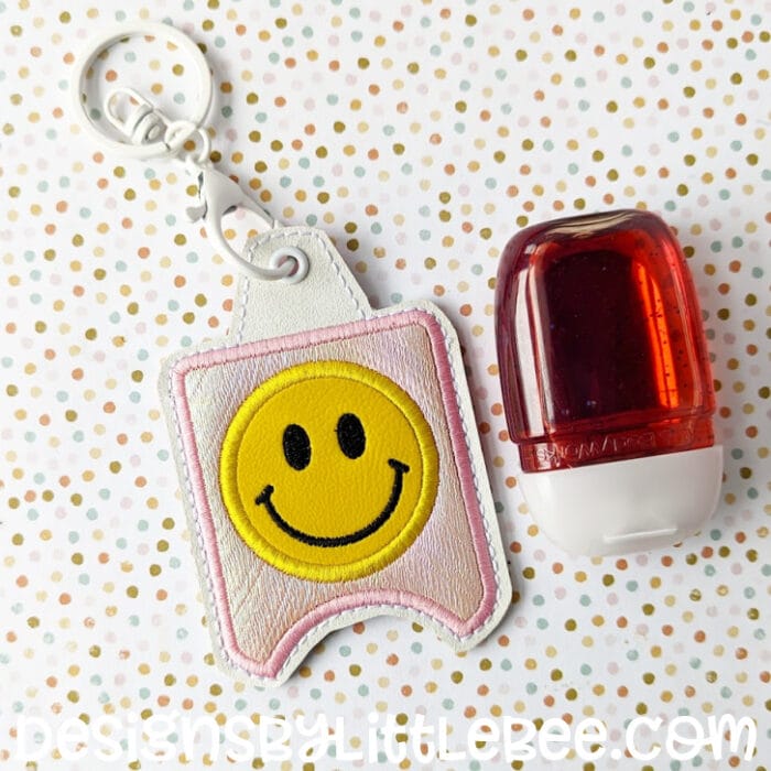 Smiley Hand Sanitizer Case - Snap Tab and Eyelet Key Fob