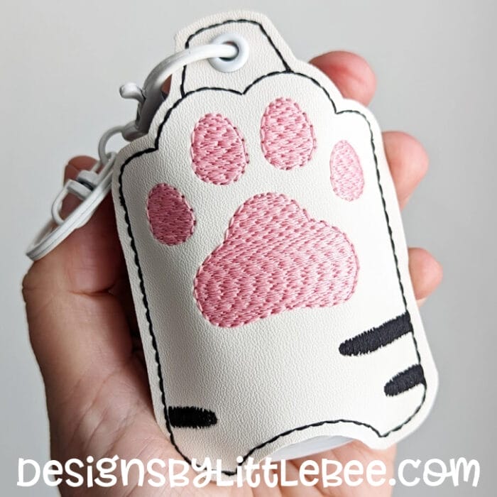 Paw Print II Hand Sanitizer Case - Snap Tab and Eyelet Key Fob